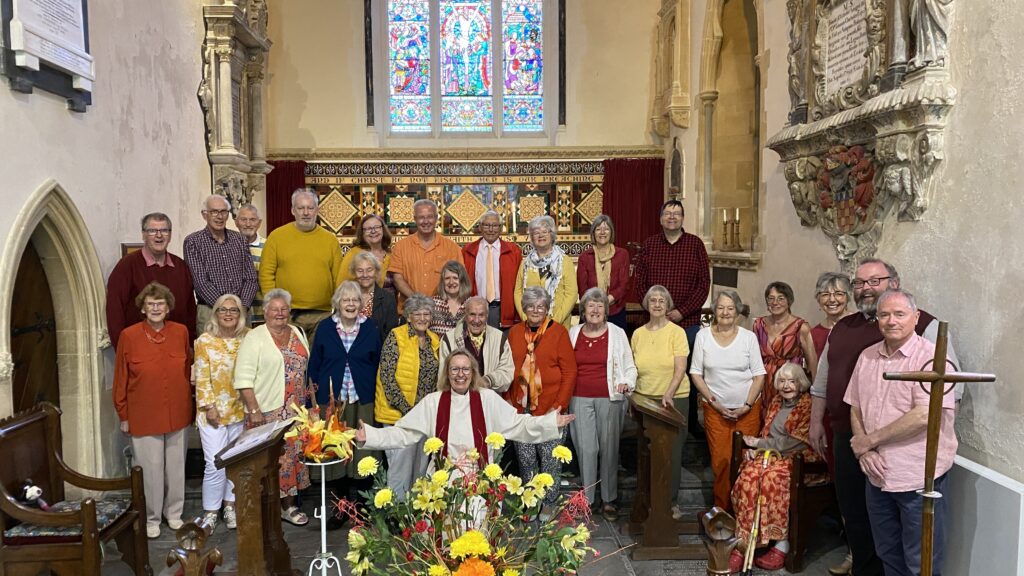 Members of the Church, with Rev Selina Garner, in front of the altar